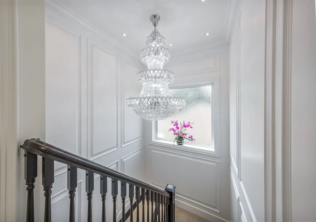 Staircase and chandelier at W 62nd Ave